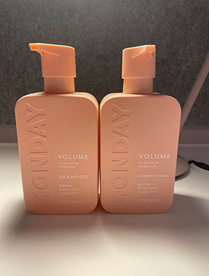 pink shampoo and conditioner bottles